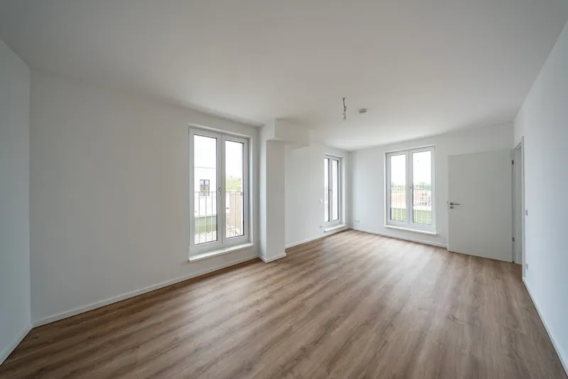 Neubauwohnung an der Waterkant mit Terrasse und Fußbodenheizung im Erstbezug — photo 1